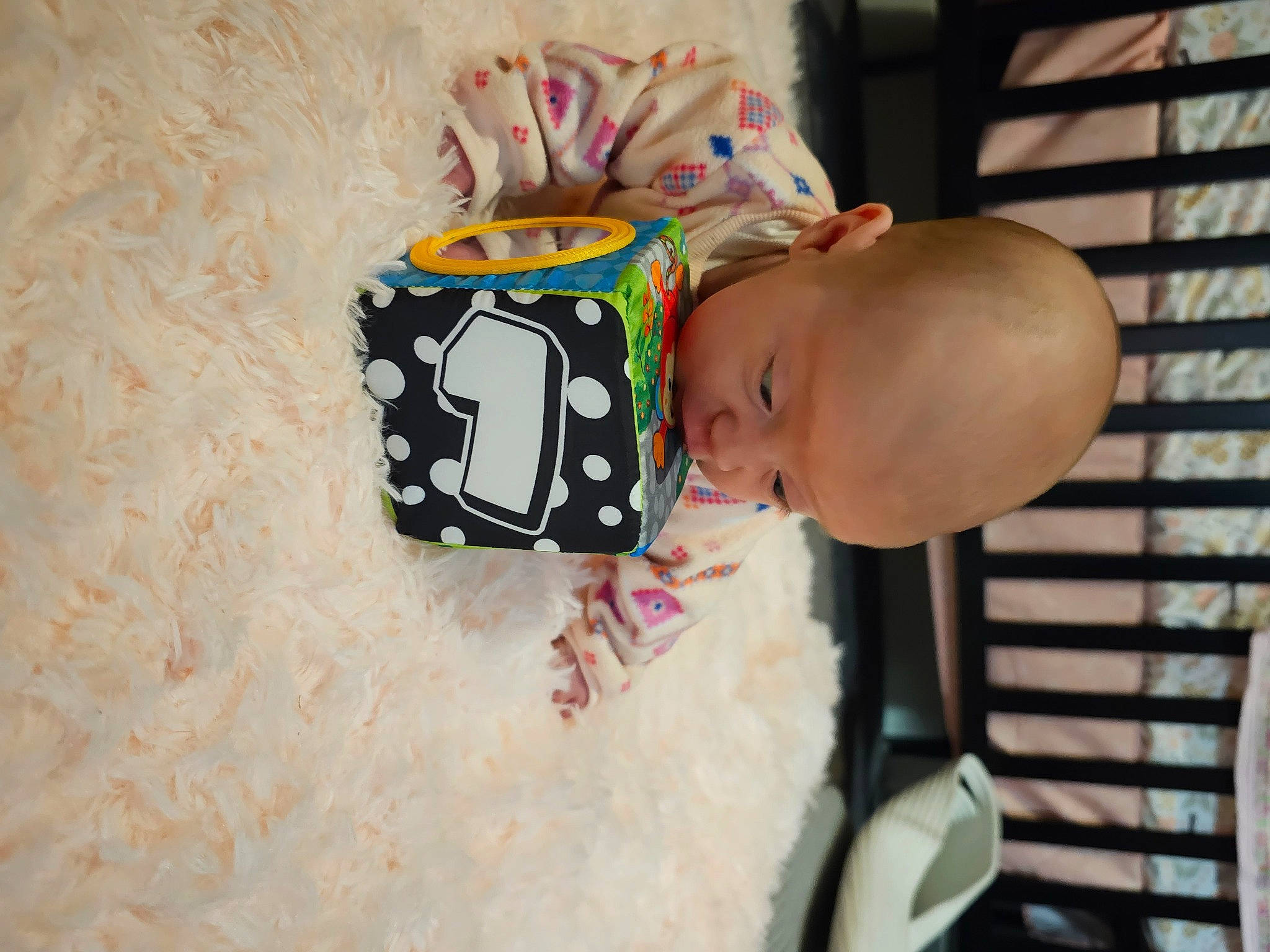 Nerys is registered to the contest to win money with this photo: baby, baby_products, baby_toddler_clothing, child, comfort, event, fashion_accessory, happy, hat, person, room, toddler