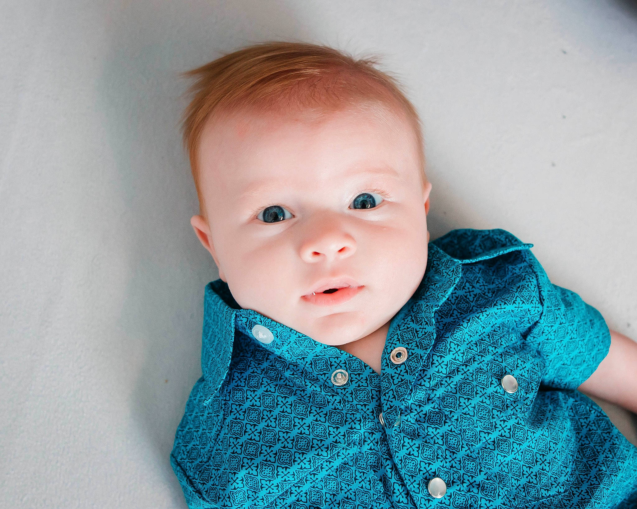 Kix is registered to the contest to win money with this photo: baby, baby_toddler_clothing, cheek, child, clothing, collar, comfort, electric_blue, eyelash, happy, iris, outerwear, pattern, person, portrait_photography, sitting, sleeve, toddler