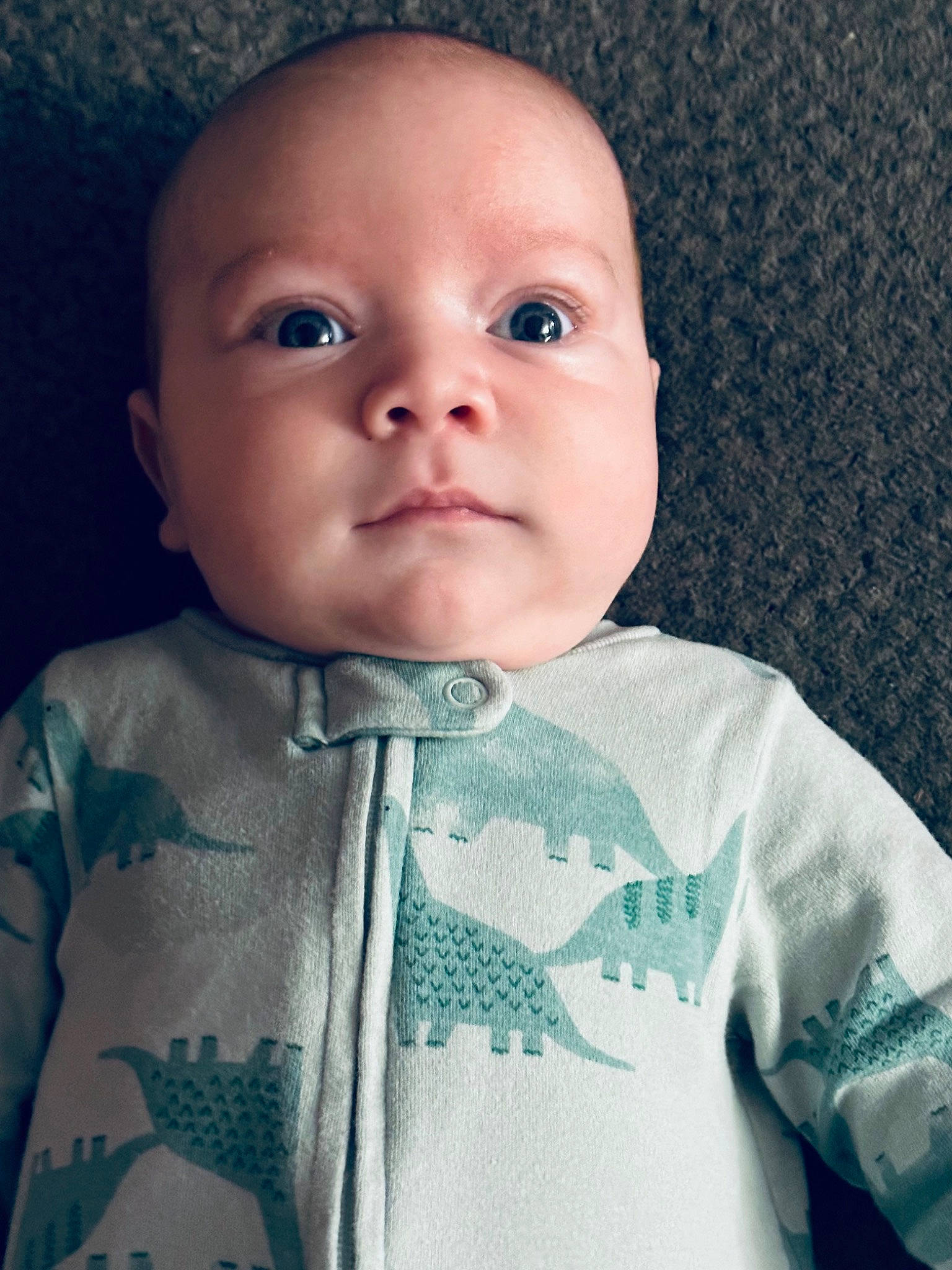 Colton is registered to the contest to win money with this photo: baby, baby_toddler_clothing, cheek, child, chin, collar, comfort, eyebrow, eyelash, face, head, iris, linens, lip, nose, pattern, person, skin, sleeve, textile