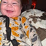 baby, child, infant, smiling, happy, portrait, indoors, blanket, onesie, pajamas, pumpkin, cat_pattern, halloween, zipper, seated, face, head, cozy, flash_photography, home