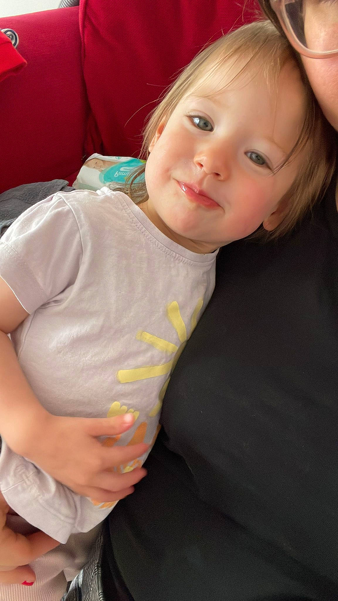 Olivia is registered to the contest to win money with this photo: arm, baby_toddler_clothing, cheek, chin, comfort, elbow, face, finger, forehead, gesture, hair, head, human_body, joint, joy, lip, nose, person, skin, sleeve