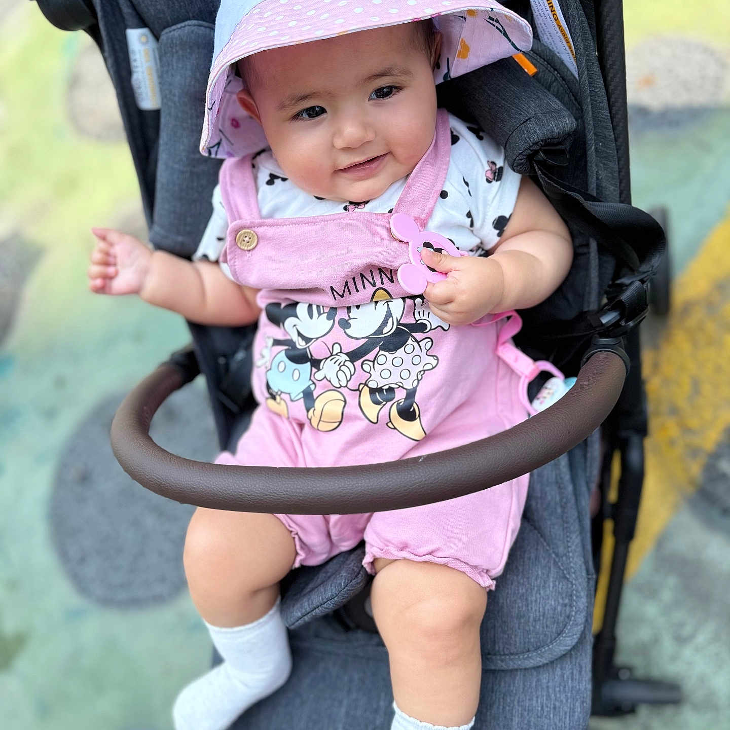 Hade is registered to the contest to win money with this photo: baby, baseballcap, bonnet, cap, clothing, coat, face, happy, hat, head, hosiery, jacket, person, photography, portrait, smile, sock, stroller, sunhat, t_shirt
