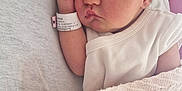 Kataleya participe au concours pour gagner de l'argent avec cette photo : baby, newborn, sleeping, infant, blanket, white_clothing, hospital_wristband, closeup, face, peaceful, resting, soft_texture, indoors, cute, skin, head, hand, person, portrait, cozy