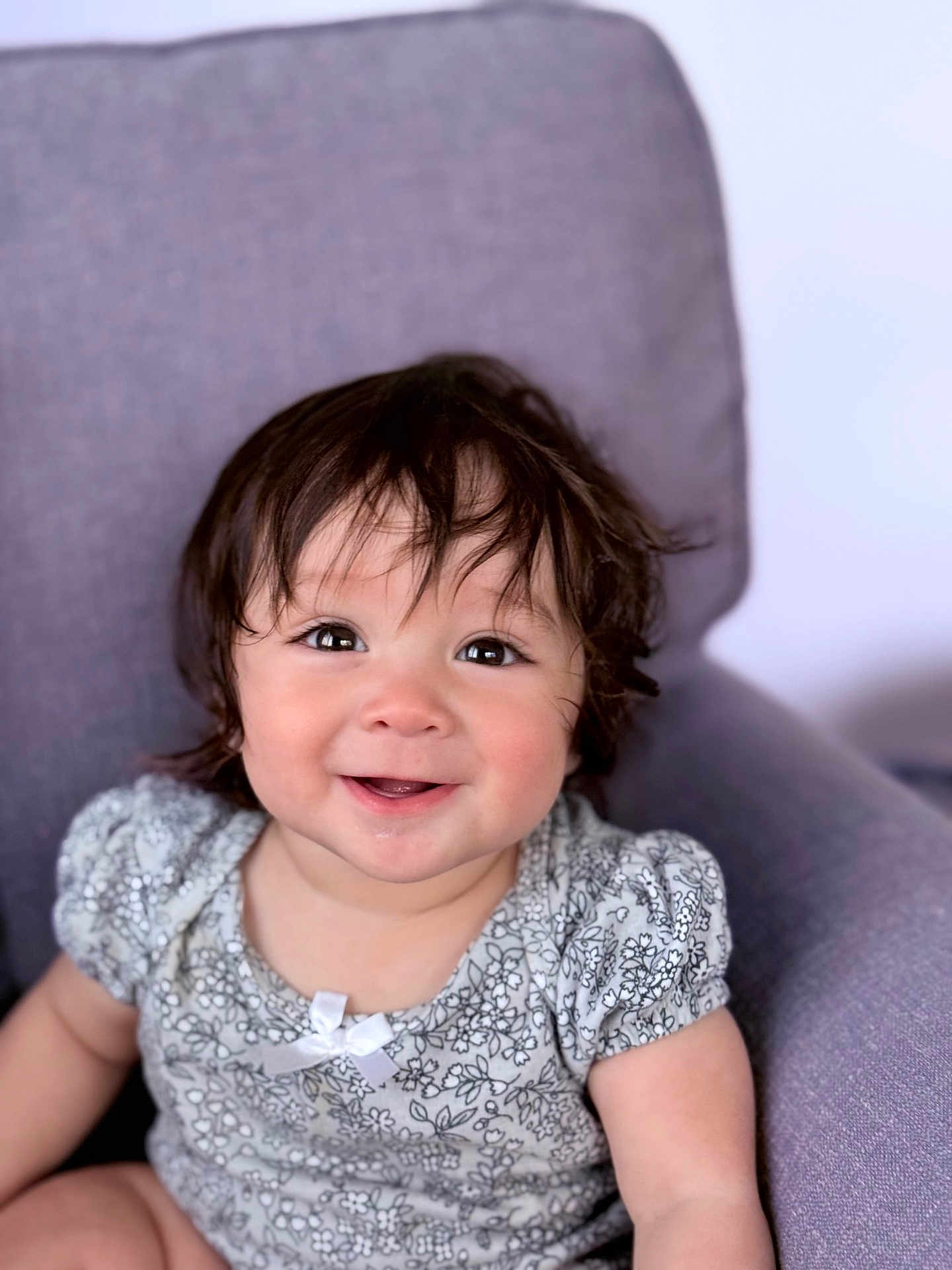 Anneli joined the competition — help win amazing prizes! toddler, child, smiling, face, hair, eyes, armchair, clothing, patterned, floral, bow, happy, cute, portrait, indoor, person, skin, baby, sitting, apparel