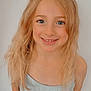 child, smiling, blonde_hair, blue_eyes, crop_top, cartoon_character, stitch, casual_clothing, young_girl, portrait, standing, light_background, happy, cute, indoors, blouse, person, face, hair, youth