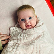 Addison joined the competition — help win amazing prizes! adorable, baby, bedding, blanket, blue_eyes, chubby_cheeks, cozy, cute, face, fingers, hand, indoor, infant, looking_up, newborn, pink_blanket, portrait, smile, soft_texture, swaddle