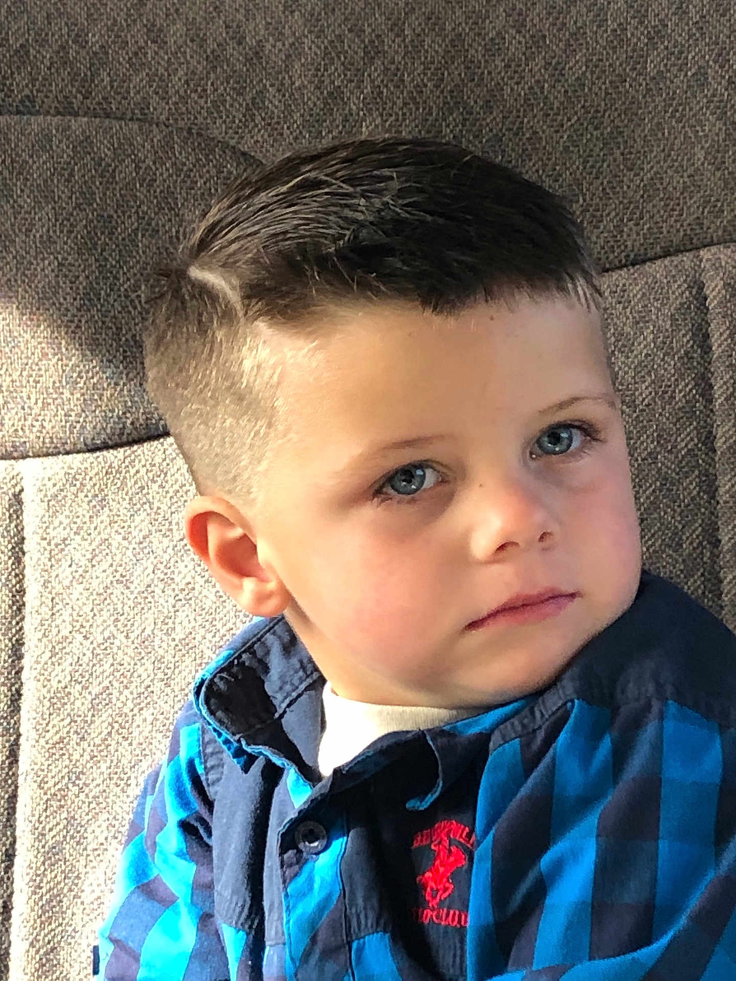 Samuel joined the competition — help win amazing prizes! blue_eyes, boy, casual_clothing, checkered, child, closeup, cute, ear, expression, eyelashes, fabric_background, face, haircut, indoor, person, portrait, seated, shirt, skin, young