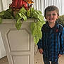 Samuel is registered to the contest to win money with this photo: blue_shirt, boy, child, concrete_floor, decor, fall, greenery, happy, jeans, leaves, outdoor, person, plaid, plant, planter, porch, pumpkin, seasonal, shoes, smile