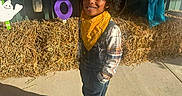 Legend joined the competition — help win amazing prizes! child, boy, cowboy_costume, hat, bandana, overalls, plaid_shirt, smiling, outdoor, halloween, decorations, hay_bale, shadow, concrete, festive, holiday, costume, cute, portrait, sunlight