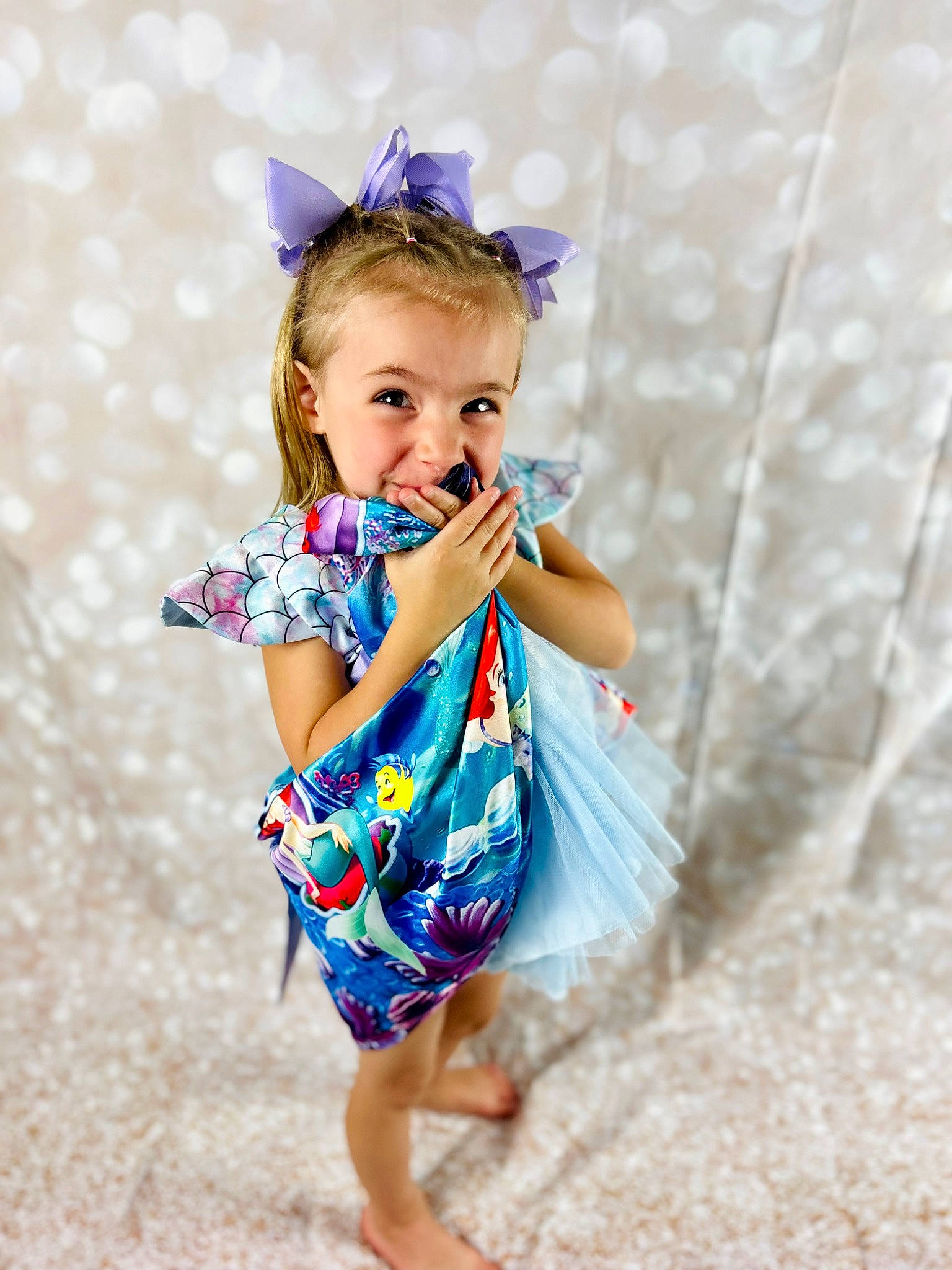 Amelia is registered to the contest to win money with this photo: aqua, baby_toddler_clothing, day_dress, dress, electric_blue, fashion_design, happy, human_body, iris, one_piece_garment, pattern, person, pink, plant, purple, shoulder, skin, sleeve, smile, toddler