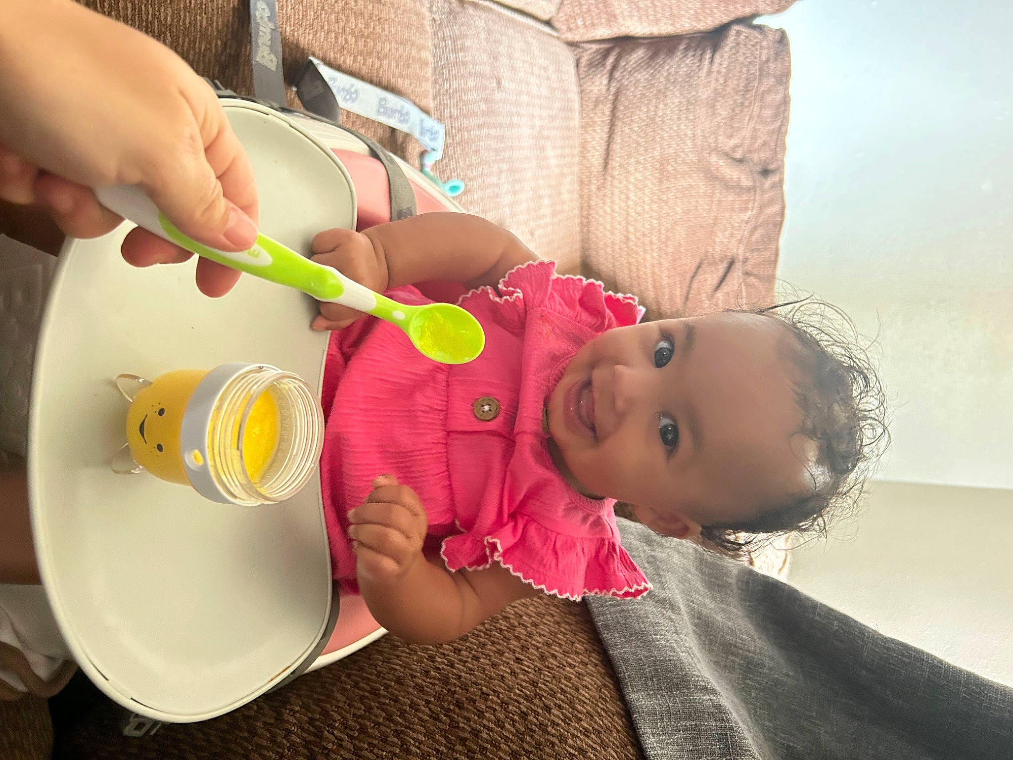 Lainey joined the competition — help win amazing prizes! baby, baby_food, baby_products, baby_toddler_clothing, cheek, child, comfort_food, drinkware, finger, food, fun, hand, happy, joy, person, play, room, sitting, skin, spoon