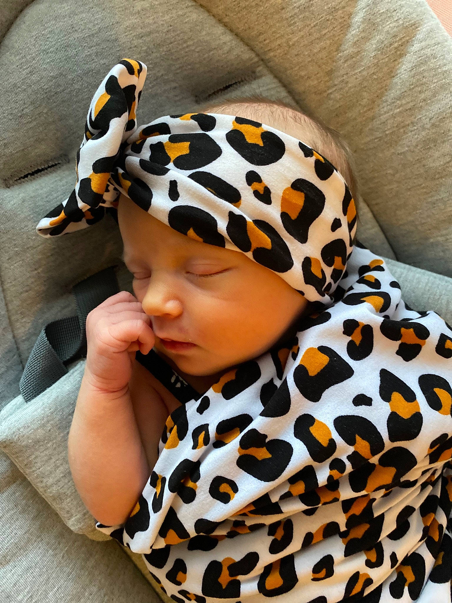 Paisley Grace is registered to the contest to win money with this photo: baby, baby_toddler_clothing, beanie, cap, child, collar, comfort, costume_accessory, costume_hat, eyewear, fashion_accessory, fashion_design, headgear, headwear, knit_cap, orange, pattern, person, personal_protective_equipment, sleeve