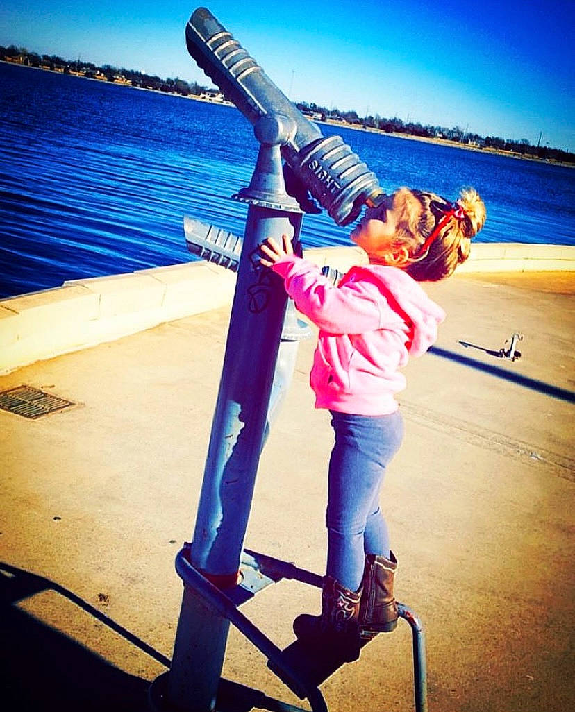 Maddison is registered to the contest to win money with this photo: boats_and_boating_equipment_and_supplies, electric_blue, flash_photography, gesture, happy, horizon, jeans, lake, landscape, leisure, morning, ocean, people_in_nature, person, recreation, selfie, sky, travel, water, wind