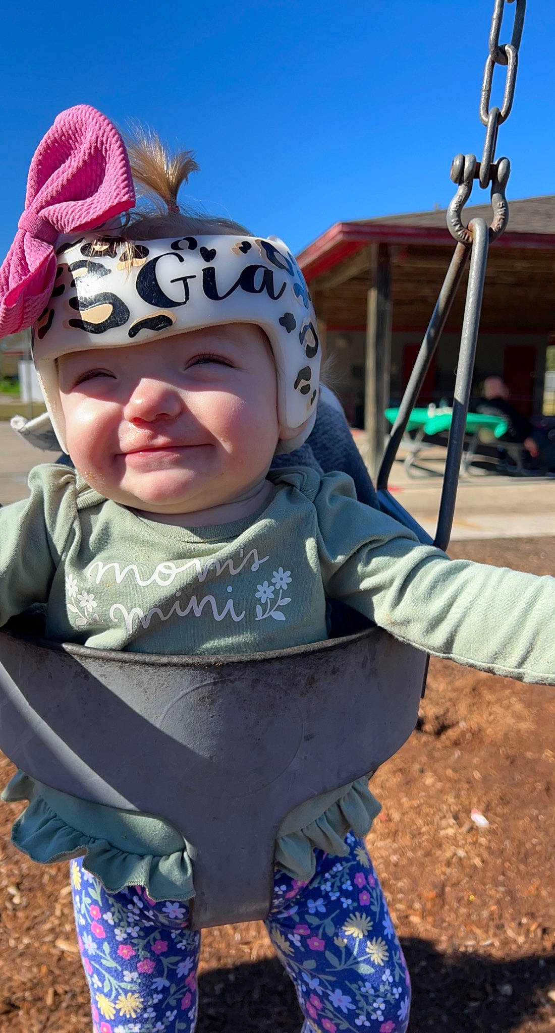 Gia is registered to the contest to win money with this photo: baby, baby_toddler_clothing, blue, cap, eye, face, fun, grass, happy, hat, headwear, joy, leisure, person, plant, public_space, recreation, sky, smile, sun_hat
