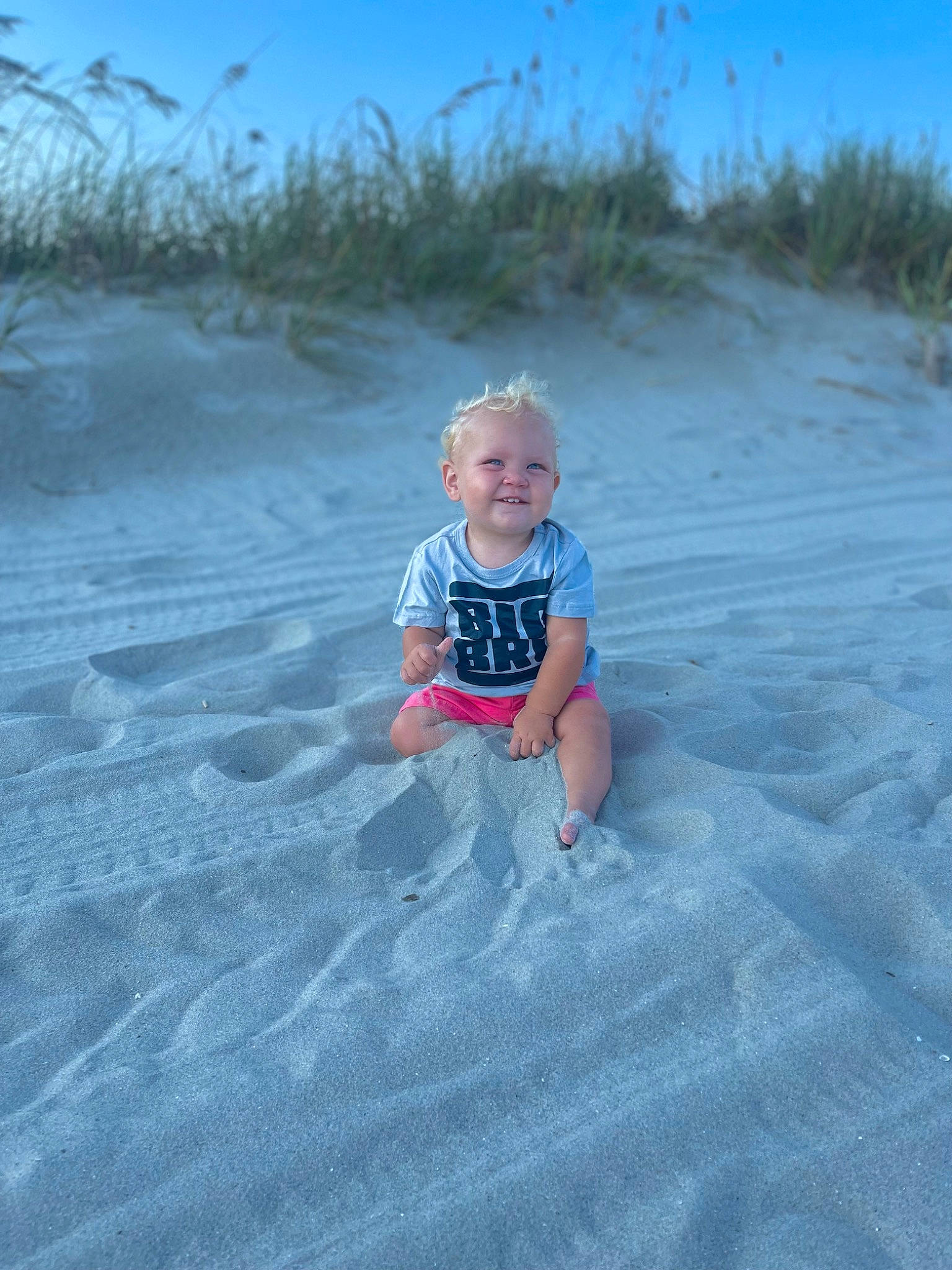 Leighton is registered to the contest to win money with this photo: azure, baby, baby_toddler_clothing, beach, child, cloud, electric_blue, fun, grass, happy, horizon, joy, landscape, leisure, people_in_nature, person, sand, singing_sand, sky, smile