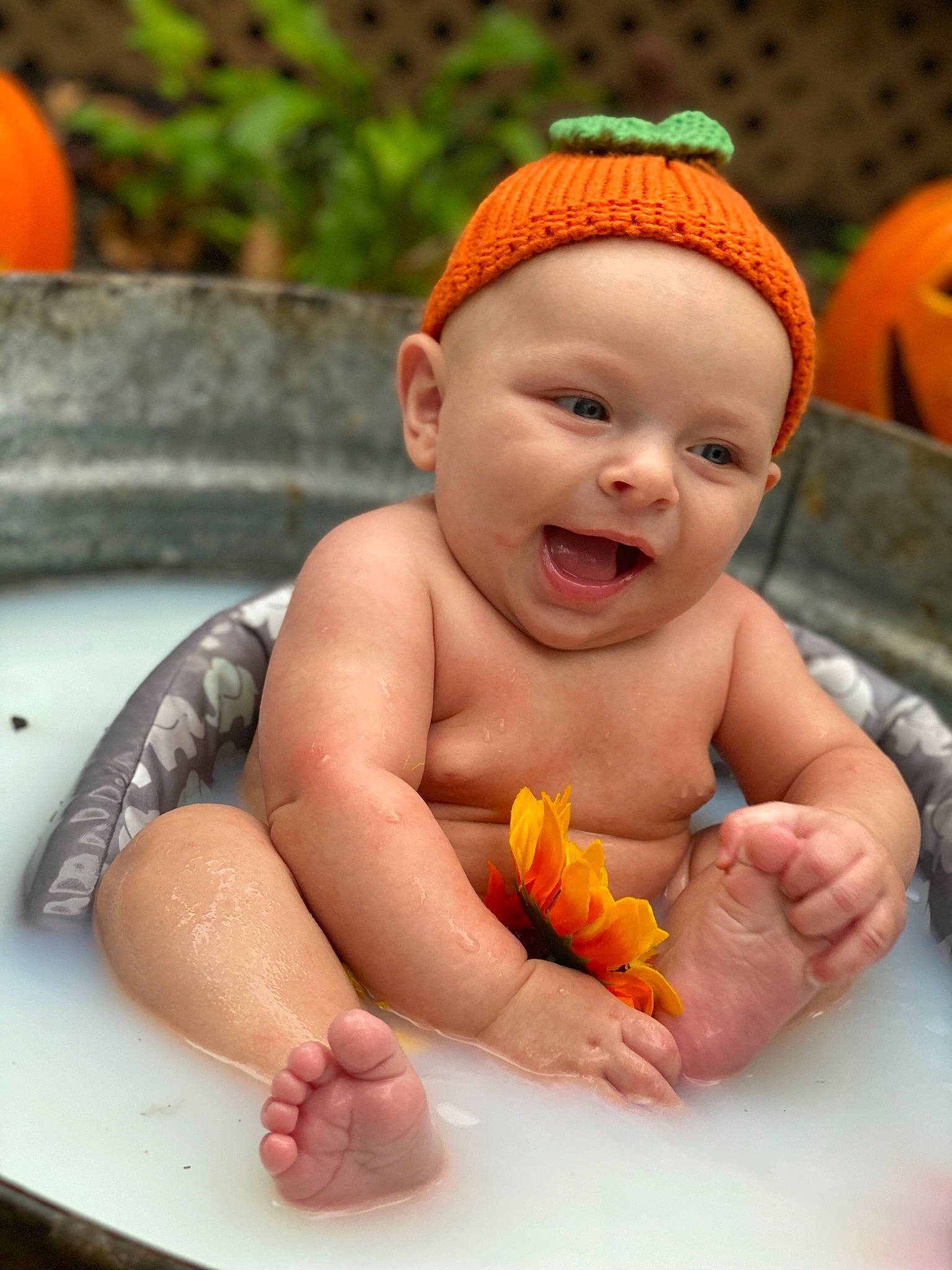 Lance is registered to the contest to win money with this photo: baby, baby_bathing, bathing, child, headwear, orange, person, toddler