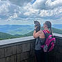 Guapa Tiny Daughter joined the competition — help win amazing prizes! woman, cat, backpack, mountains, clouds, nature, outdoor, scenery, hiking, tattoo, wooden_deck, sky, leisure, pet, companion, view, greenery, daytime, casual_clothing, braid