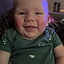 Harley joined the competition — help win amazing prizes! baby, smiling, child, green_clothing, indoor, lamp, face, cheeks, onesie, seated, home, cozy, portrait, infant, cute, happy, skin, person, head, expression