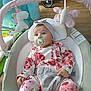 baby, baby_rocker, child, comfort, cute, floral_clothing, gray, headband, home, indoor, infant, pacifier, pink, relaxing, seated, soft_toys, toy_butterfly, toy_unicorn, white, wooden_floor