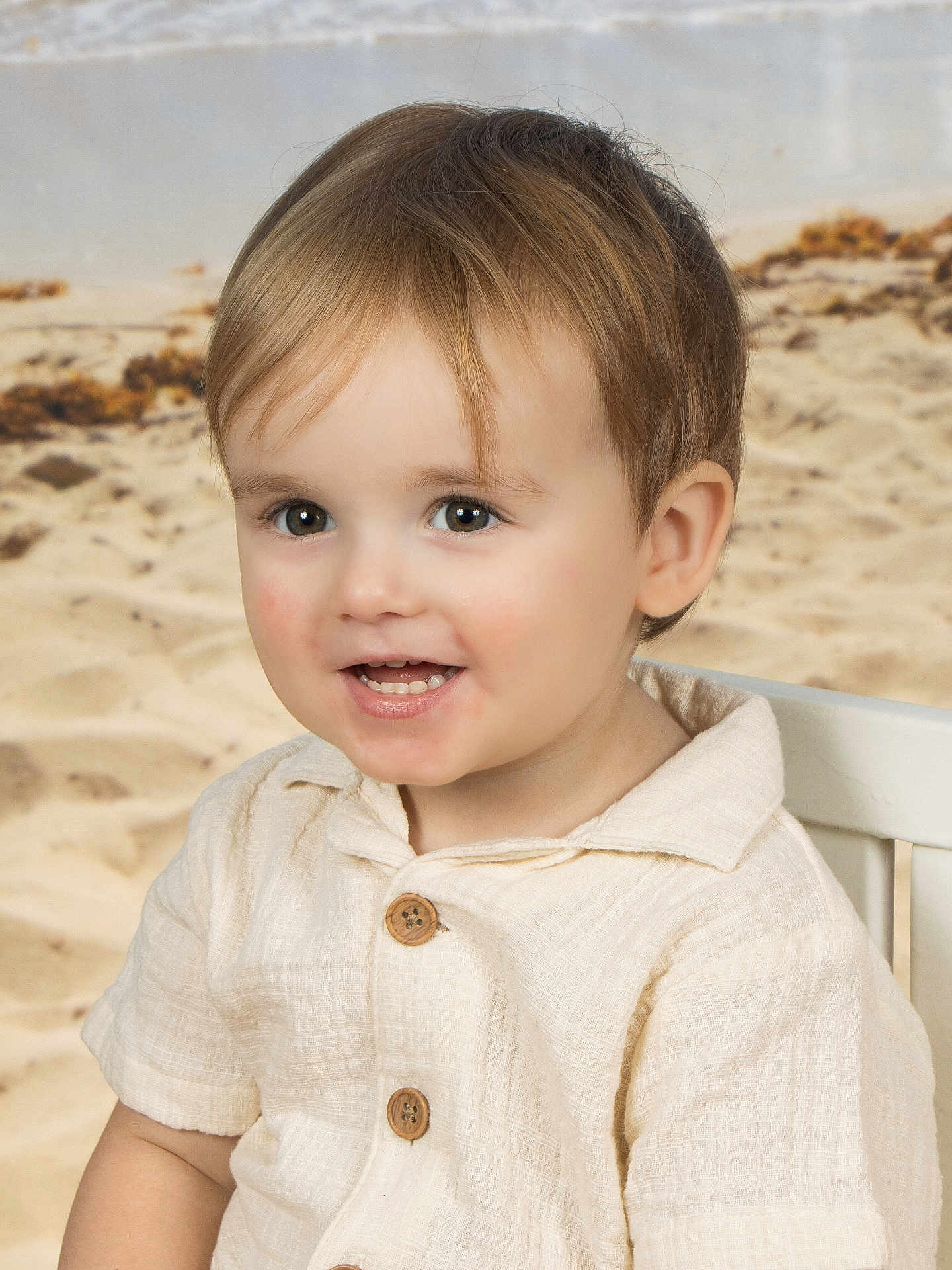 Levi joined the competition — help win amazing prizes! toddler, child, smile, face, eyes, shirt, button, chair, beach, sand, portrait, happy, cute, blond_hair, short_hair, indoor, baby, clothing, person, young_child