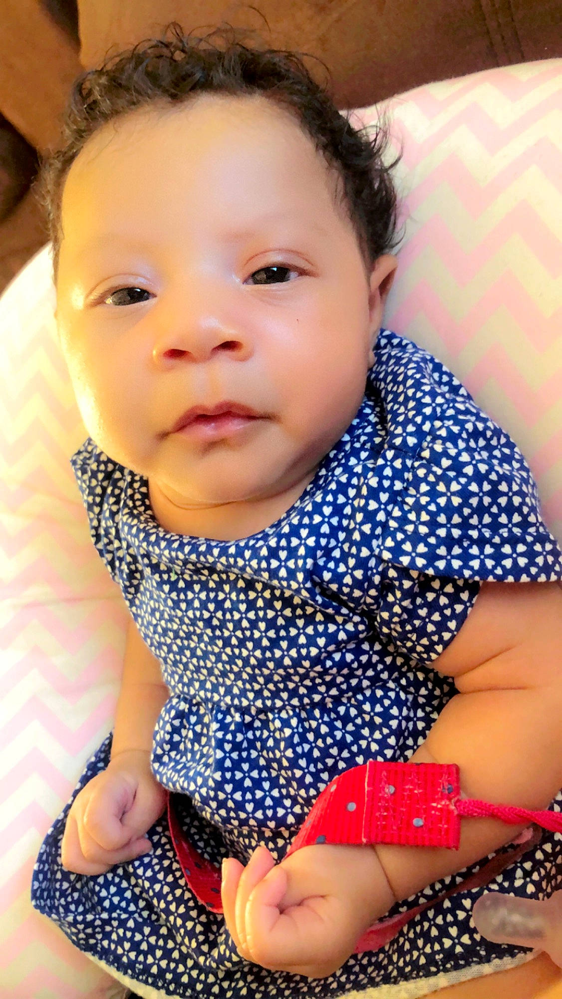 Kaleah is registered to the contest to win money with this photo: baby, beauty, black_hair, cheek, child, child_model, design, face, head, lip, nose, pattern, person, polka_dot, sitting, skin, smile, toddler