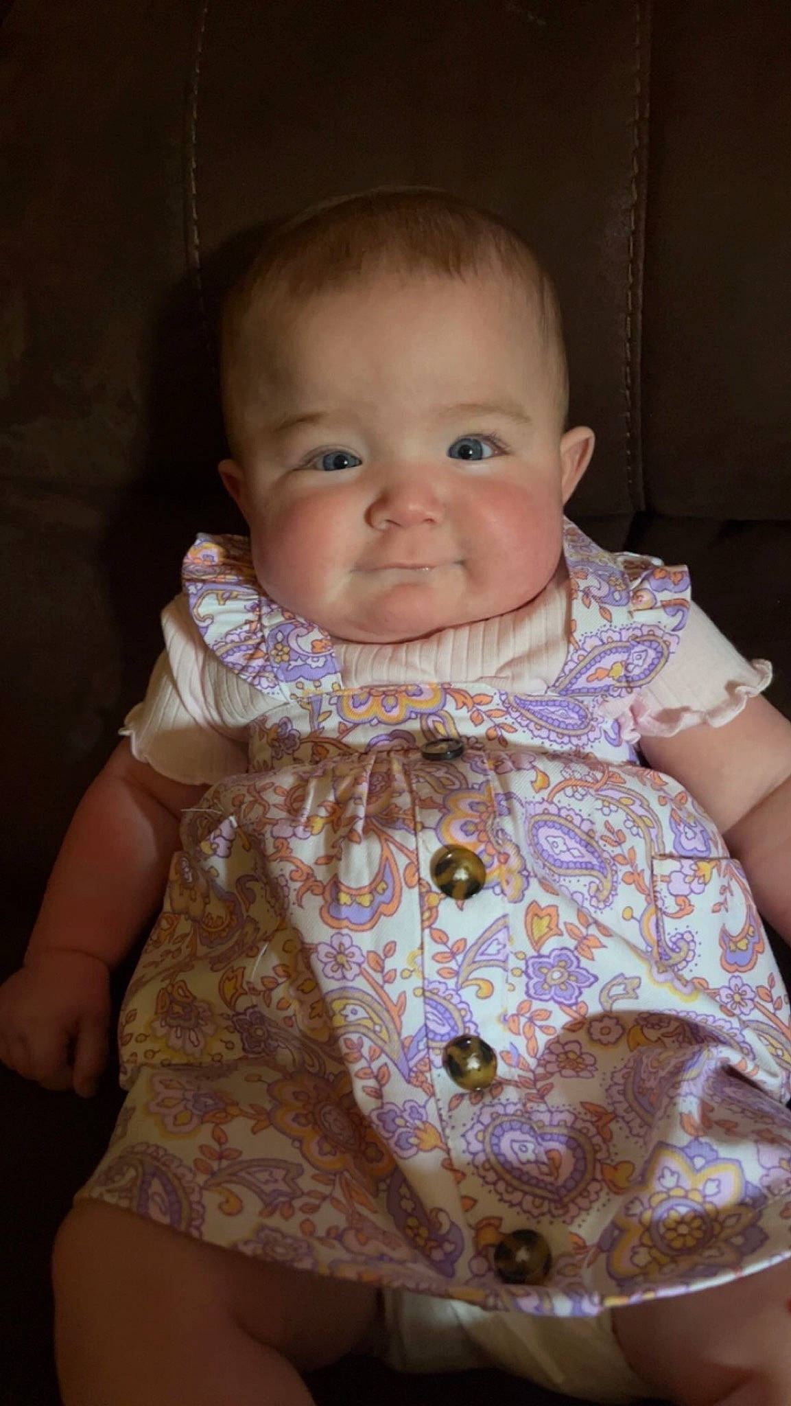 Austyn is registered to the contest to win money with this photo: baby, baby_toddler_clothing, cheek, child, chin, collar, dress, eyebrow, face, head, iris, lip, neck, outerwear, person, sitting, skin, sleeve, smile, standing