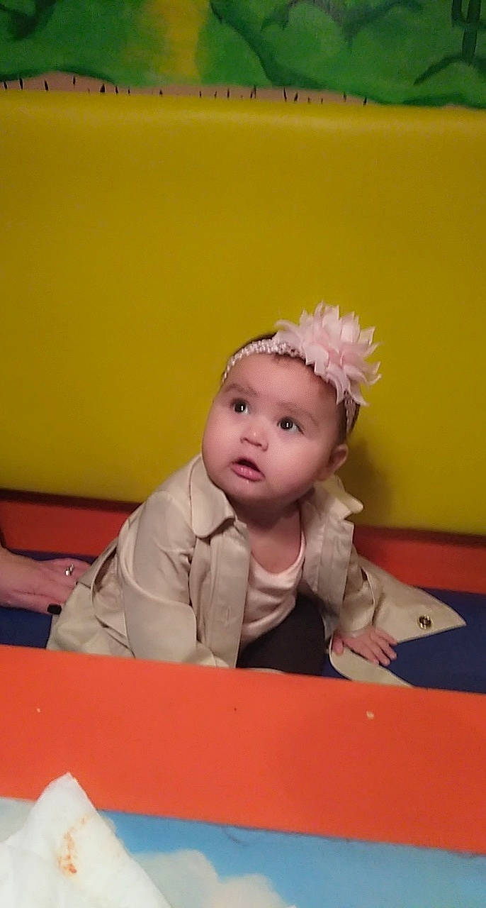 Mia Marie joined the competition — help win amazing prizes! baby, baby_toddler_clothing, chair, child, eye, face, fashion_accessory, flooring, fun, hair_accessory, happy, head, headband, headpiece, peach, person, play, room, sitting, table