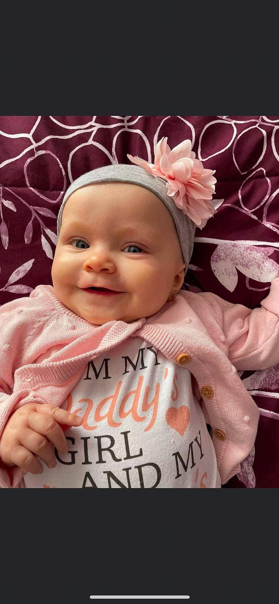 Kitana is registered to the contest to win money with this photo: baby, baby_laughing, baby_toddler_clothing, cheek, child, cool, event, face, font, fun, happy, headpiece, headwear, joy, magenta, pattern, person, petal, pink, skin