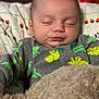 Morgan joined the competition — help win amazing prizes! baby, sleeping, blanket, onesie, dinosaur, infant, cozy, cute, peaceful, child, face, soft_lighting, nap, indoor, portrait, clothing, bed, rest, young, toddler