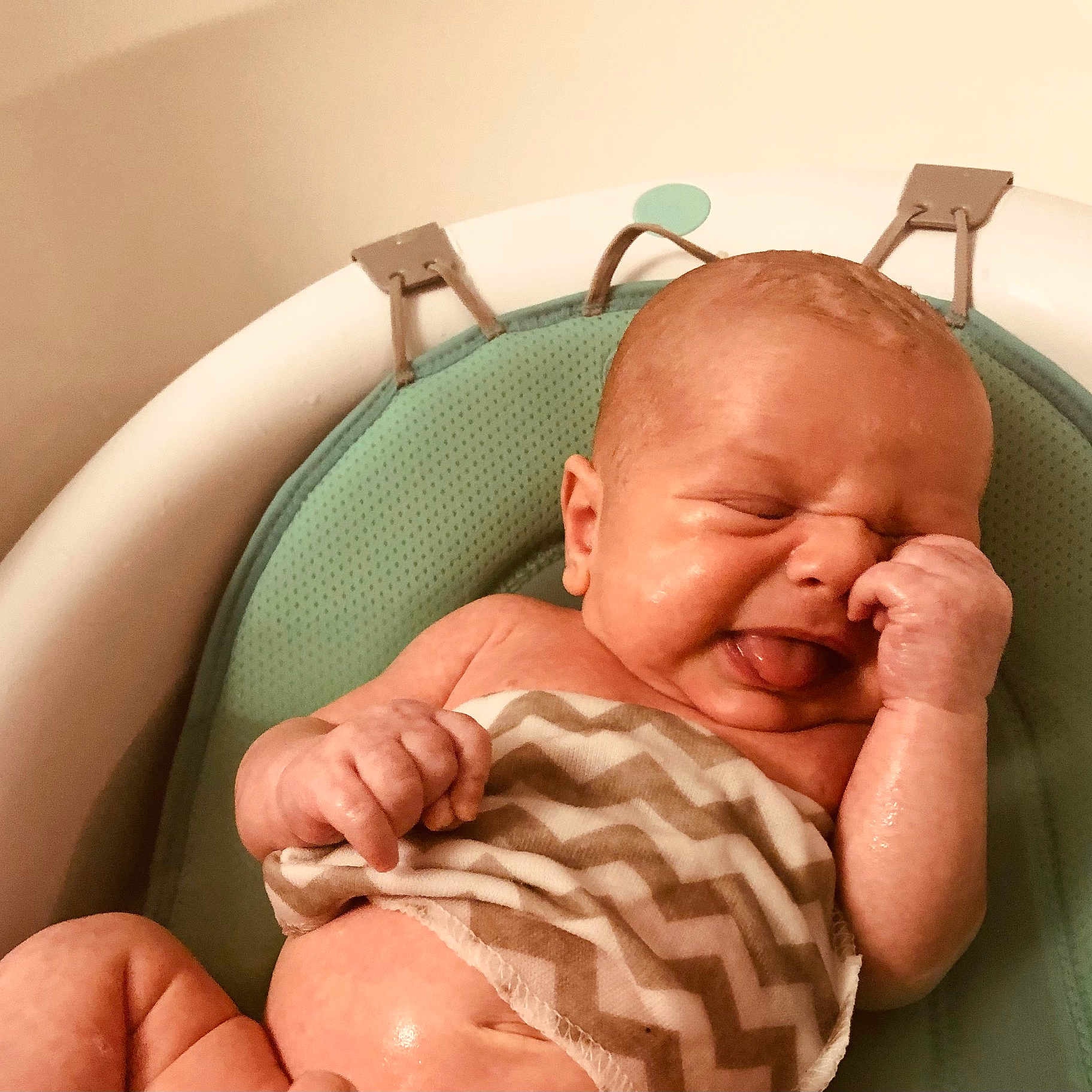 Morgan is registered to the contest to win money with this photo: arm, baby, bath, bathroom, child, cushion, cute, expression, face, hand, human, infant, newborn, pattern, seat, skin, tongue, water, wet, zigzag
