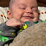 Morgan is registered to the contest to win money with this photo: baby, smile, sleeping, blanket, cozy, infant, face, cute, clothing, rest, child, peaceful, portrait, soft, warm, indoors, newborn, comfort, happy, closeup