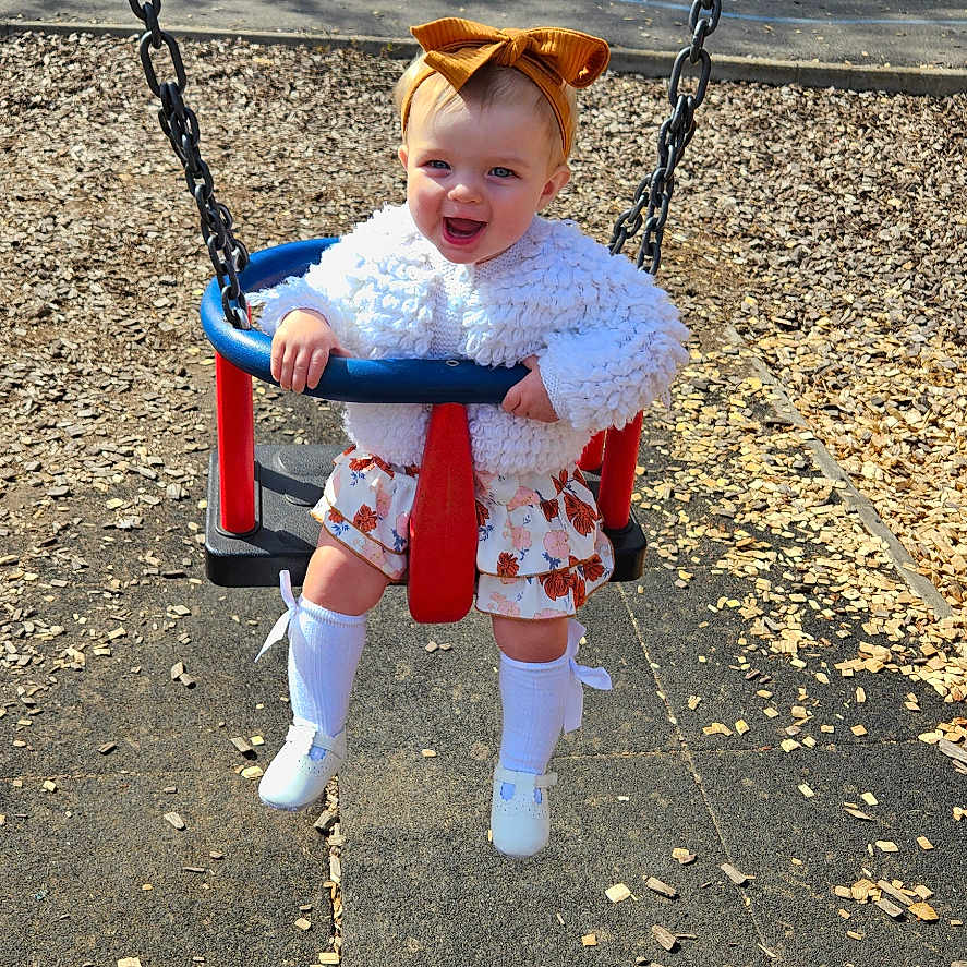 Maggie-Mae is registered to the contest to win money with this photo: accessories, adult, baby, bag, bench, face, grass, handbag, head, male, man, nature, outdoorplayarea, outdoors, park, person, photography, plant, playarea, portrait