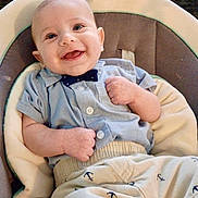 Maddox joined the competition — help win amazing prizes! baby, smiling, infant, blue_shirt, bow_tie, anchor_pattern, pants, baby_seat, cushion, happy, portrait, child, clothing, cute, indoor, person, small_hands, light_skin, seated, comfortable