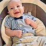 anchor_pattern, baby, baby_seat, blue_shirt, bow_tie, child, clothing, comfortable, cushion, cute, happy, indoor, infant, light_skin, pants, person, portrait, seated, small_hands, smiling