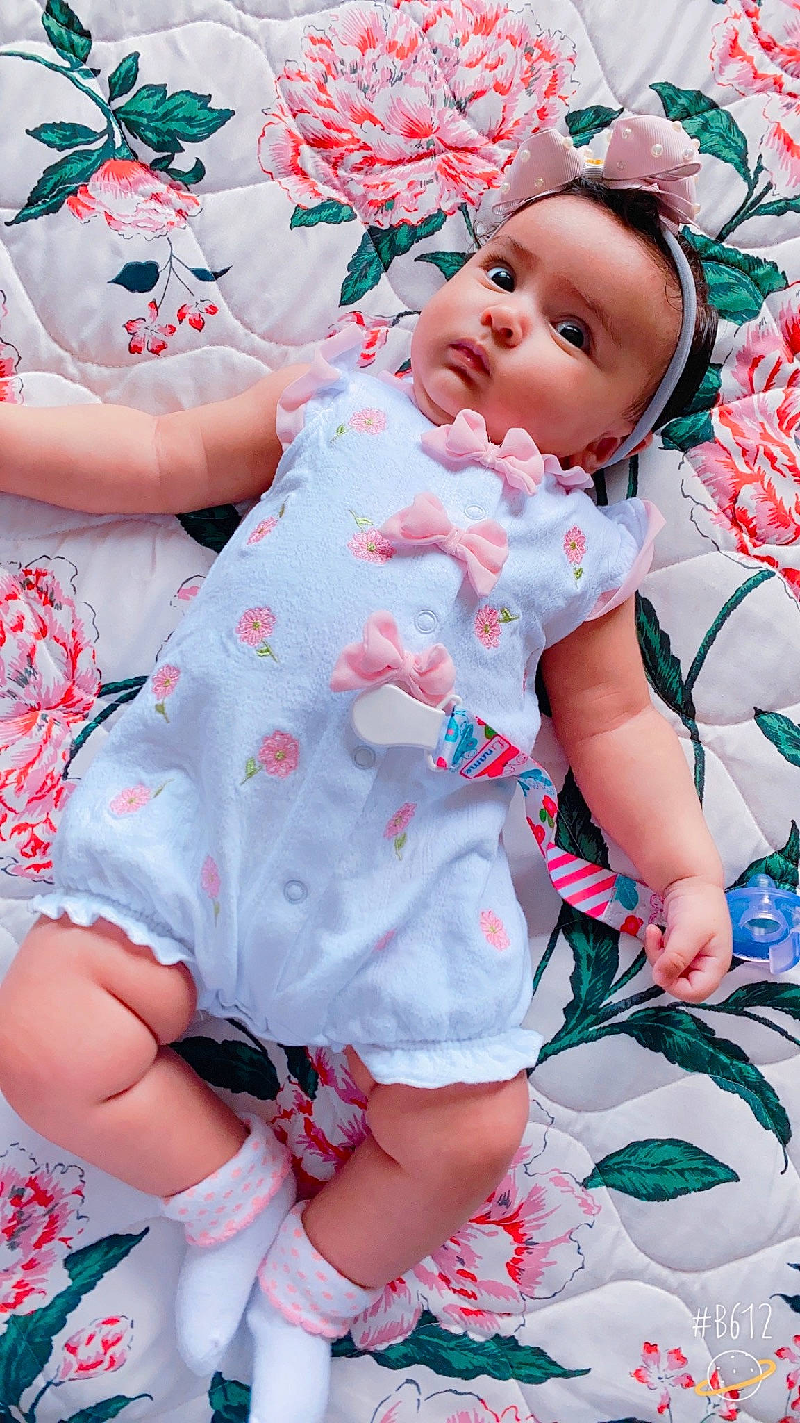 Laura joined the competition — help win amazing prizes! baby, baby_toddler_clothing, beauty, cheek, child, dress, face, fun, happy, head, human_leg, pattern, person, petal, pink, skin, sleeve, textile, thigh, toddler