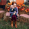 Raelynn is registered to the contest to win money with this photo: child, toddler, parent, woman, family, portrait, smiling, outdoor, autumn, fall, pumpkins, hay_bales, sunflowers, maple_leaves, harvest, plaid_blanket, grass, farm, seasonal_decor, sitting