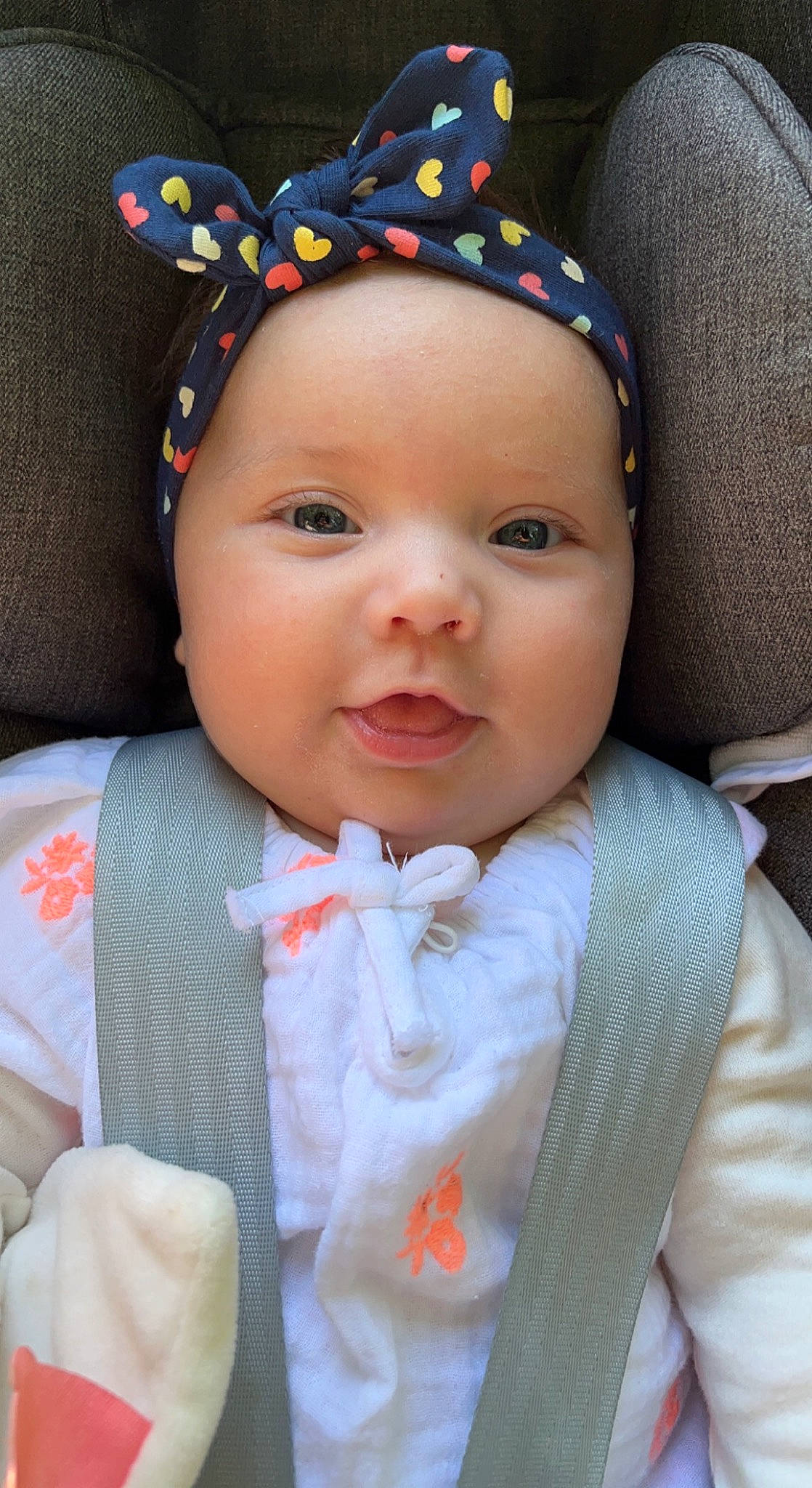 Myla a rejoint le concours — aidez-le/la à gagner de superbes lots ! baby, baby_toddler_clothing, cap, cheek, child, costume_hat, eye, eyelash, happy, headwear, iris, lip, nose, outerwear, pattern, person, pink, product, skin, textile