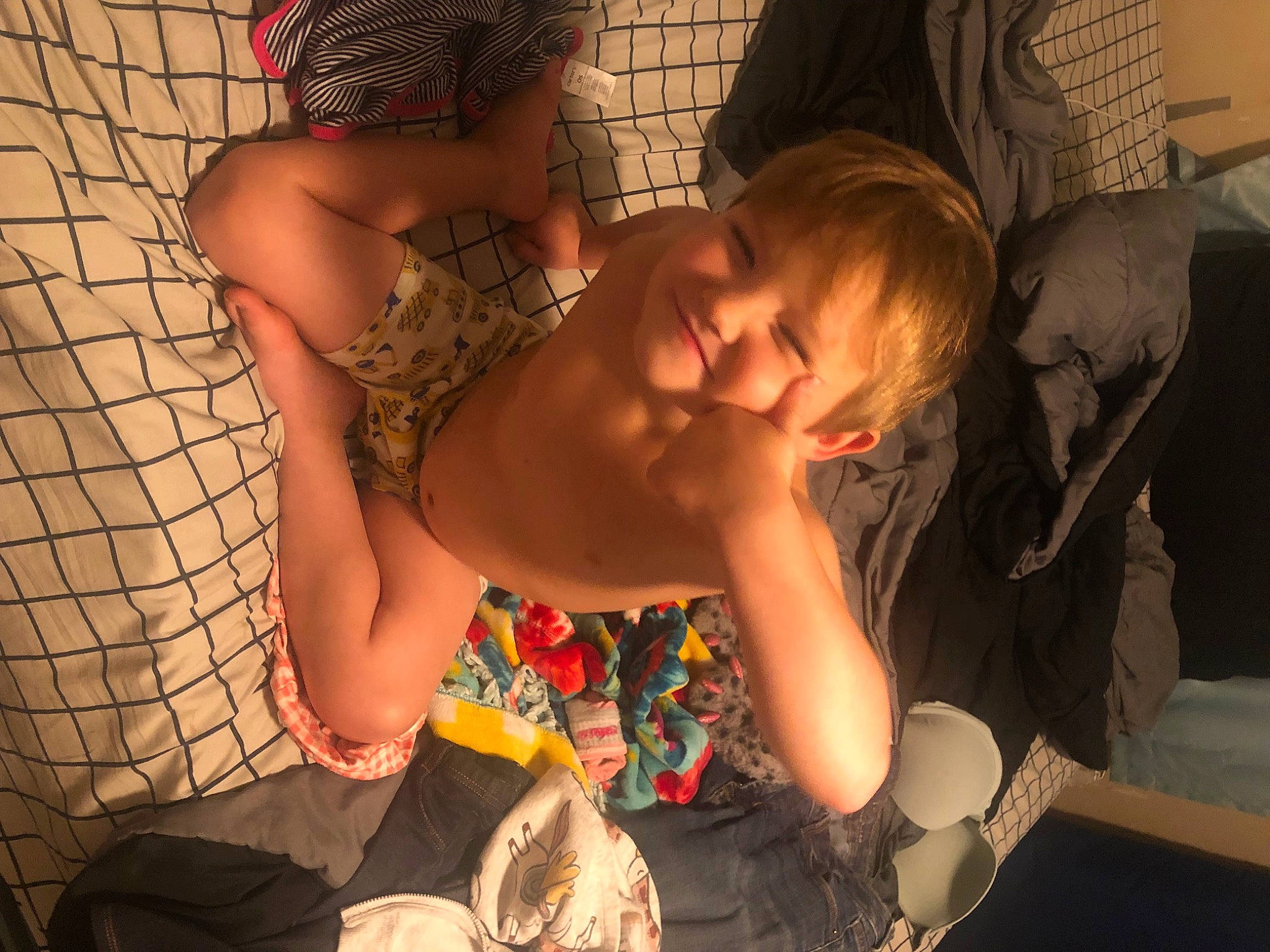 Matthew is registered to the contest to win money with this photo: abdomen, baby, bathing, black_hair, blond, chest, child, comfort, elbow, flesh, fun, happy, human_leg, joy, mesh, mouth, pattern, person, sitting, thigh