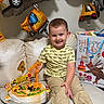 Maksym joined the competition — help win amazing prizes! balloons, birthday, boy, cake, celebration, child, construction_toys, couch, decorations, face, gift_bag, happy, indoor, khaki_pants, number_4, party, person, smile, toy_trucks, yellow_shirt