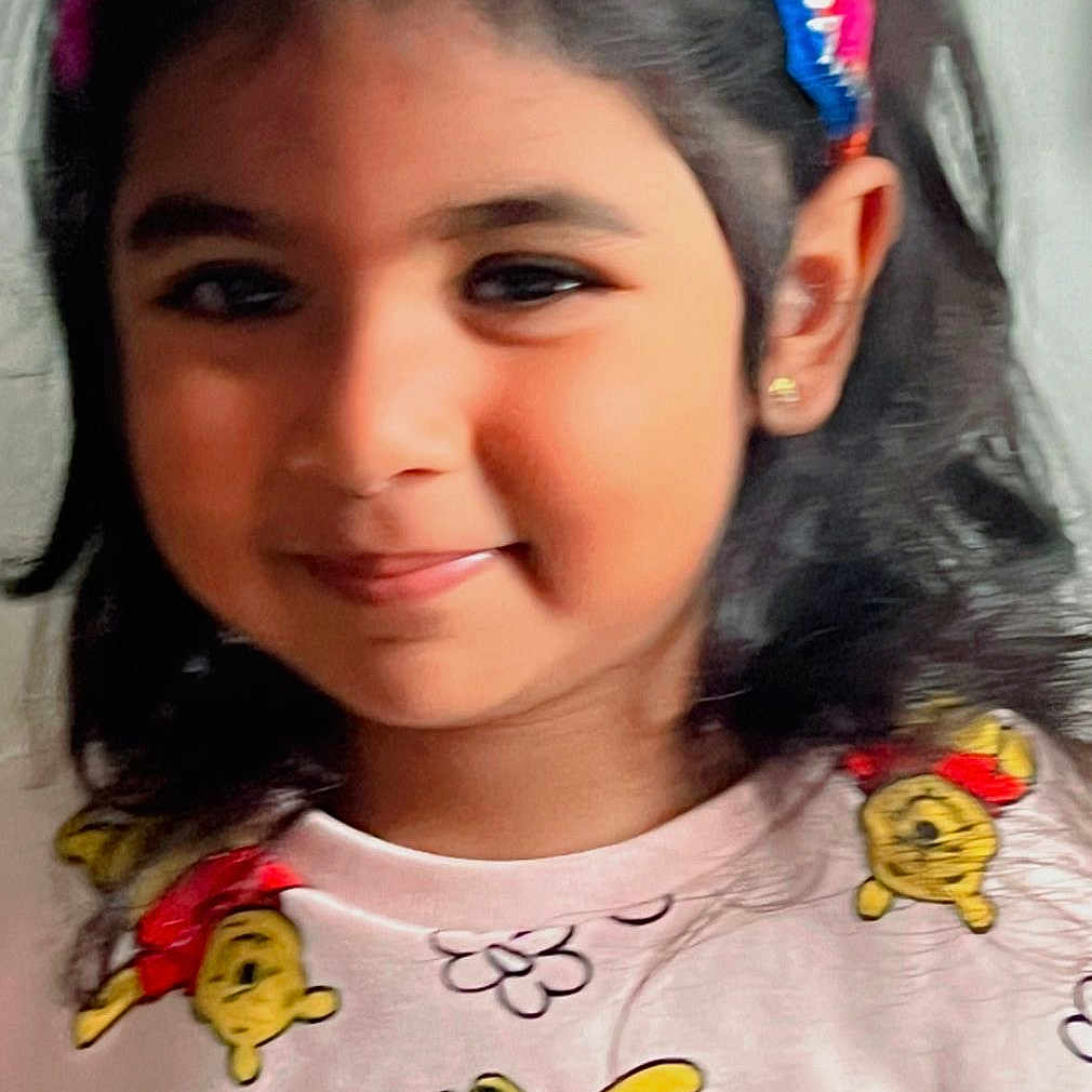 Daanya Zainab joined the competition — help win amazing prizes! casual, child, closeup, clothing, colorful, cute, earrings, face, girl, hair, happy, headband, indoors, person, playful, portrait, shirt, smile, winnie_the_pooh, young