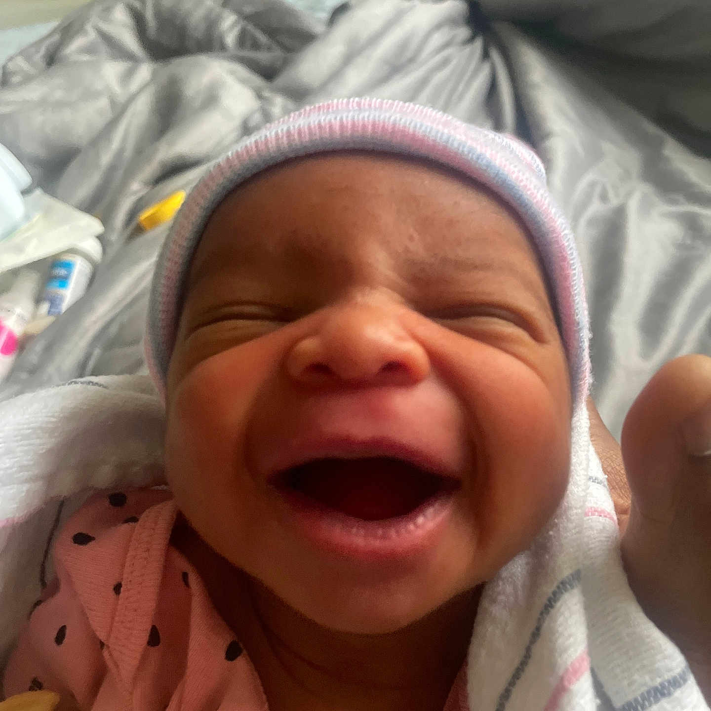 Zyana joined the competition — help win amazing prizes! newborn, baby, smiling, hat, blanket, infant, close_up, face, pink_clothing, sleepwear, happy, wrapped, cozy, bed, indoors, cute, child, person, newborn_clothing, soft
