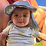 adult, baby, blue_sky, casual_clothing, child, drool, face, grass, hat, legs, nature, outdoor, person, portrait, shirt, sleeveless_top, stain, summer, sunny, turtle_print