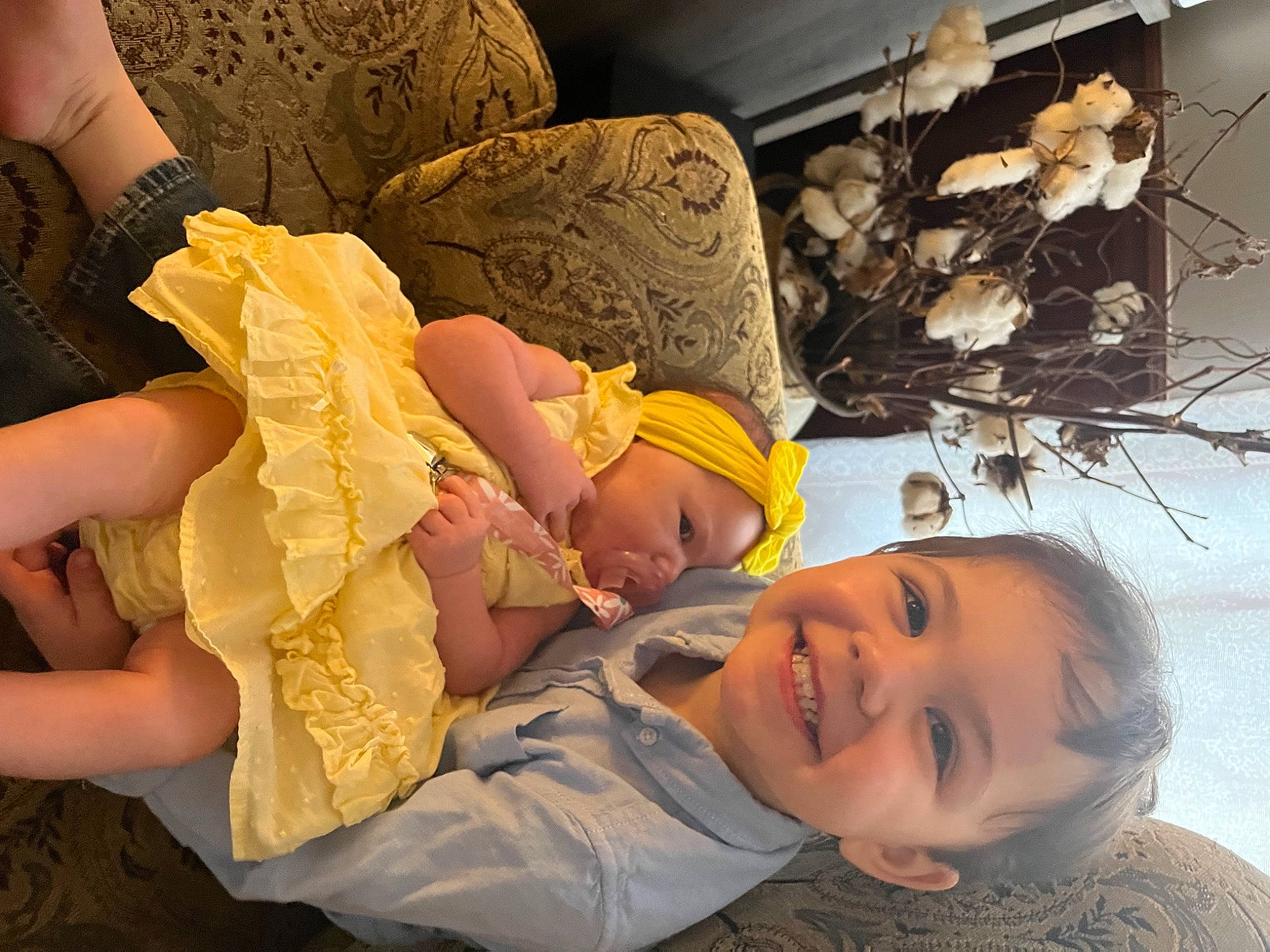 Alaina is registered to the contest to win money with this photo: baby, baby_toddler_clothing, cheek, child, comfort, couch, eye, fun, happy, hat, head, joy, person, room, sitting, smile, toddler, tree