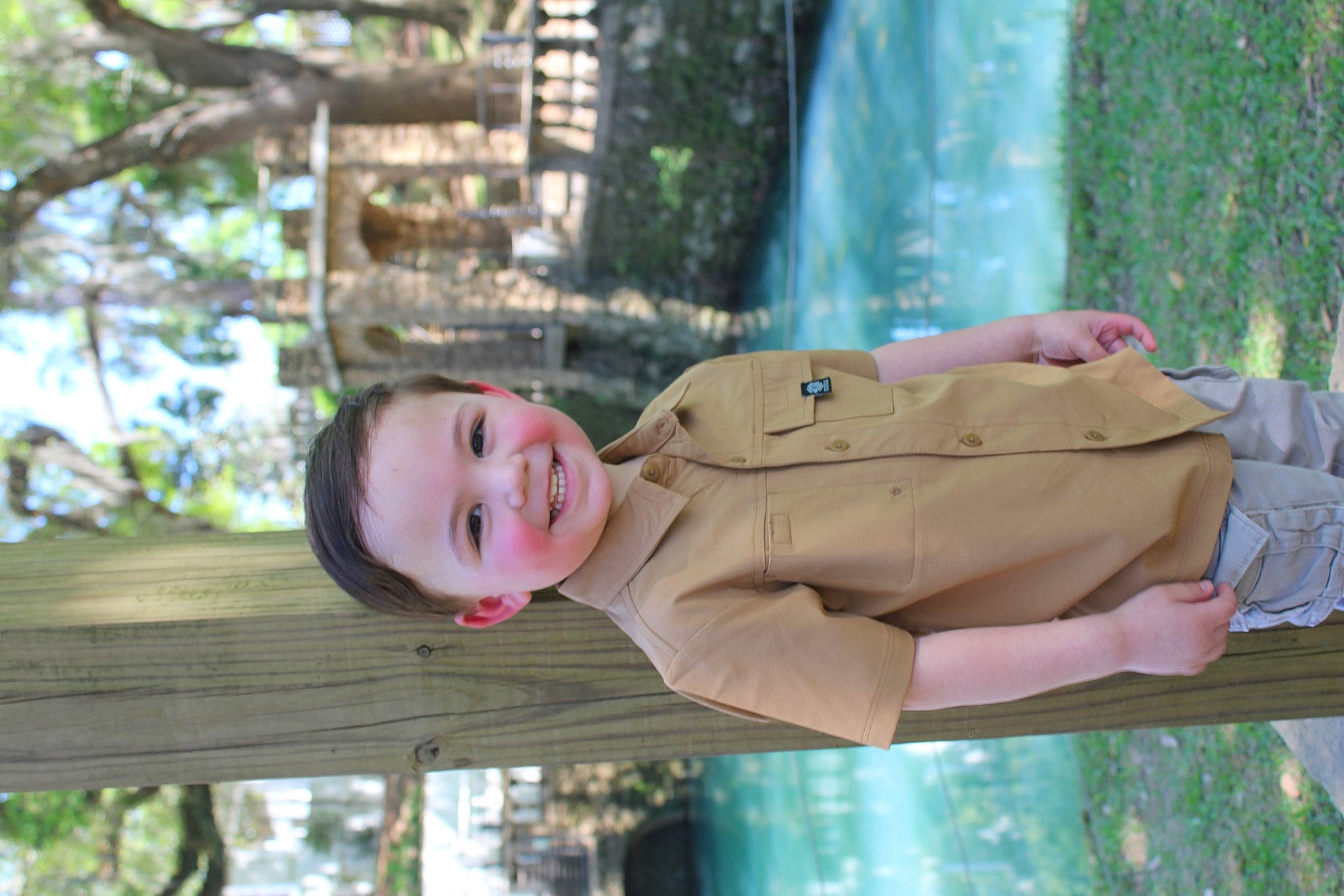 Noah is registered to the contest to win money with this photo: baby, baby_toddler_clothing, botany, child, fun, grass, green, happy, hat, joy, leaf, leisure, people_in_nature, person, plant, sitting, smile, spring, toddler, tree