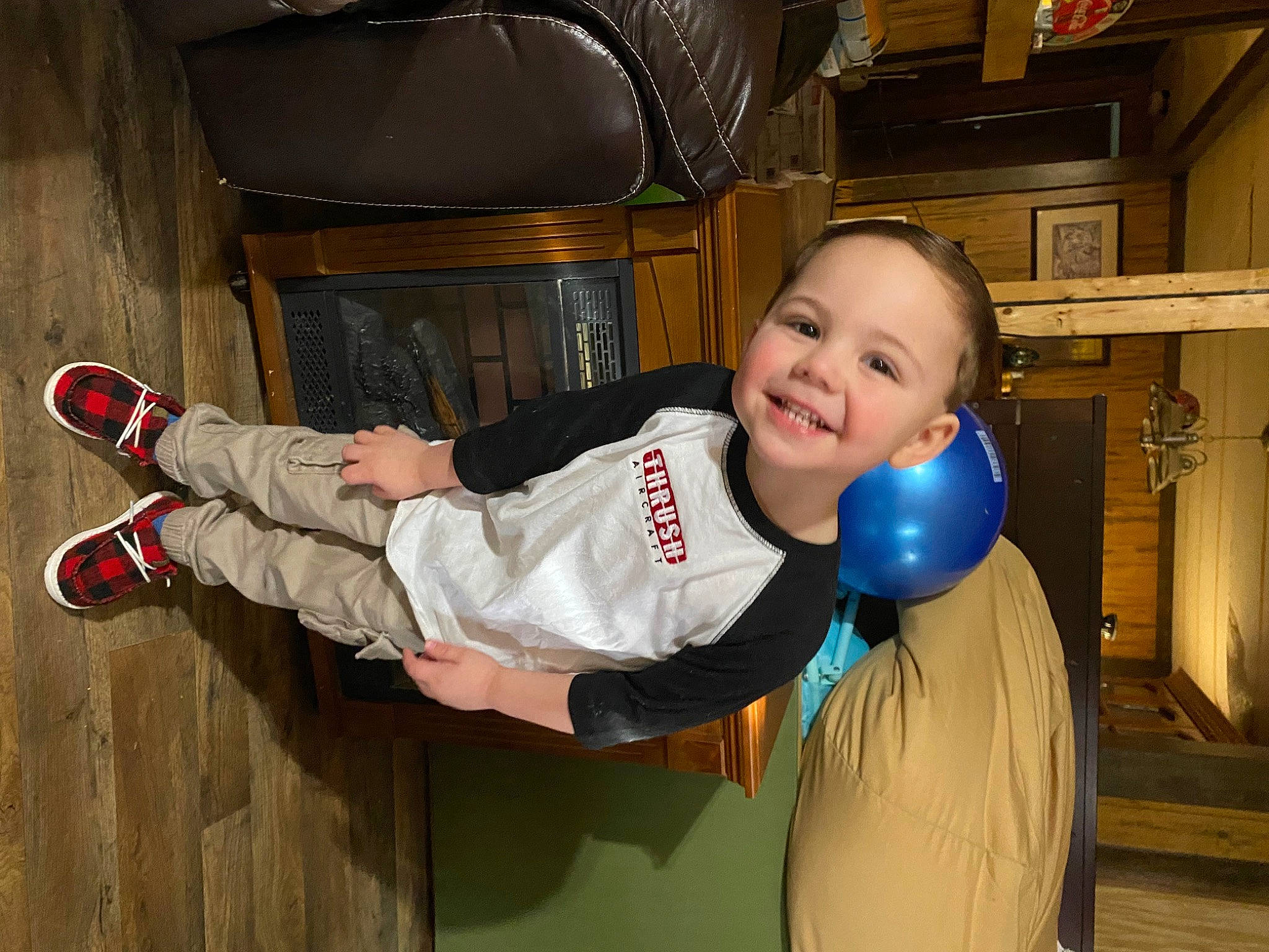 Noah is registered to the contest to win money with this photo: baby_toddler_clothing, child, comfort, electric_blue, flash_photography, flooring, fun, happy, joy, knee, leisure, outdoor_shoe, person, sitting, sleeve, smile, sneakers, t_shirt, thumb, toddler