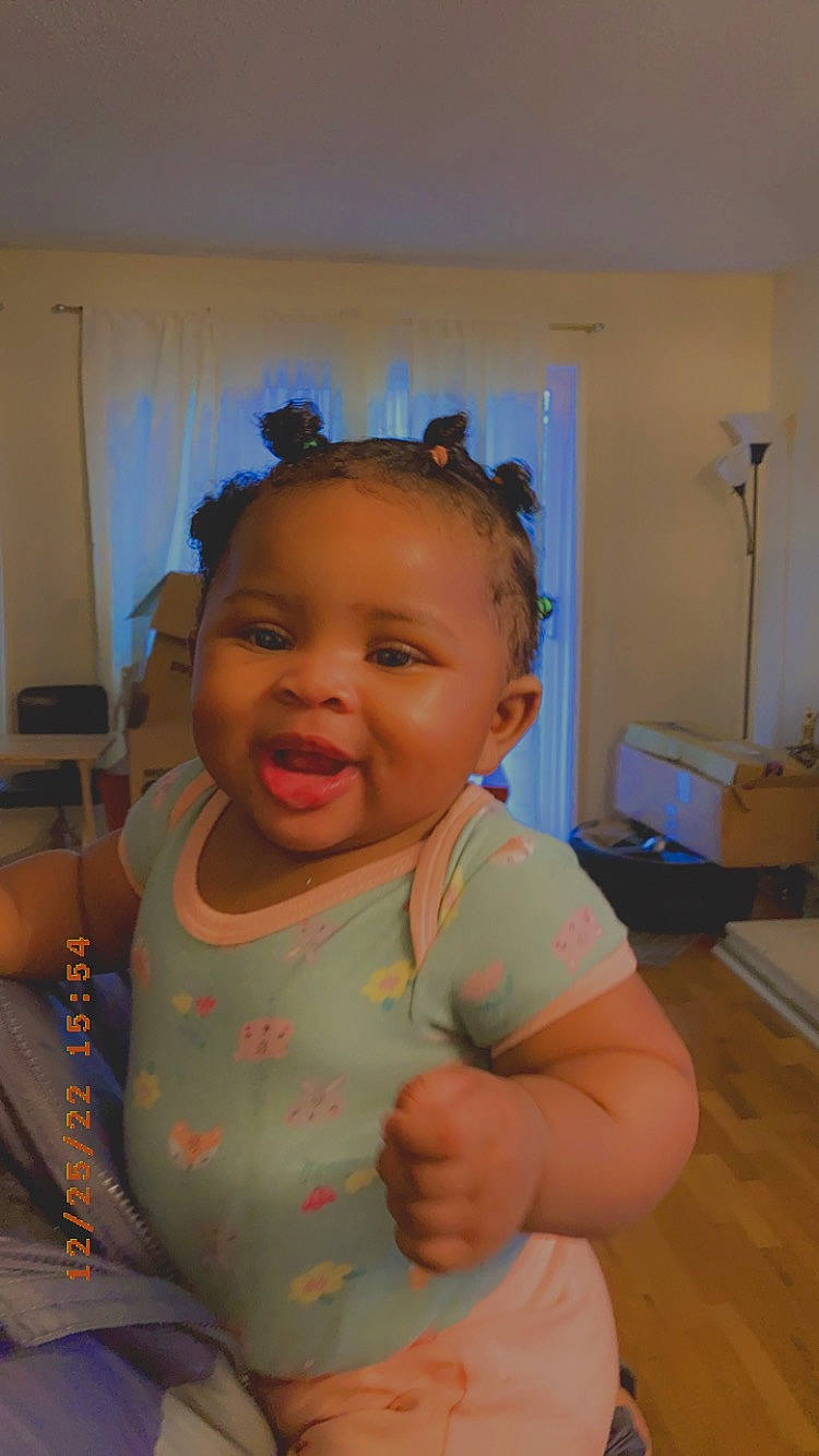 Zendaya is registered to the contest to win money with this photo: abdomen, baby, baby_toddler_clothing, chair, cheek, child, finger, fun, happy, head, iris, lip, mouth, neck, nose, person, skin, smile, thumb, toddler