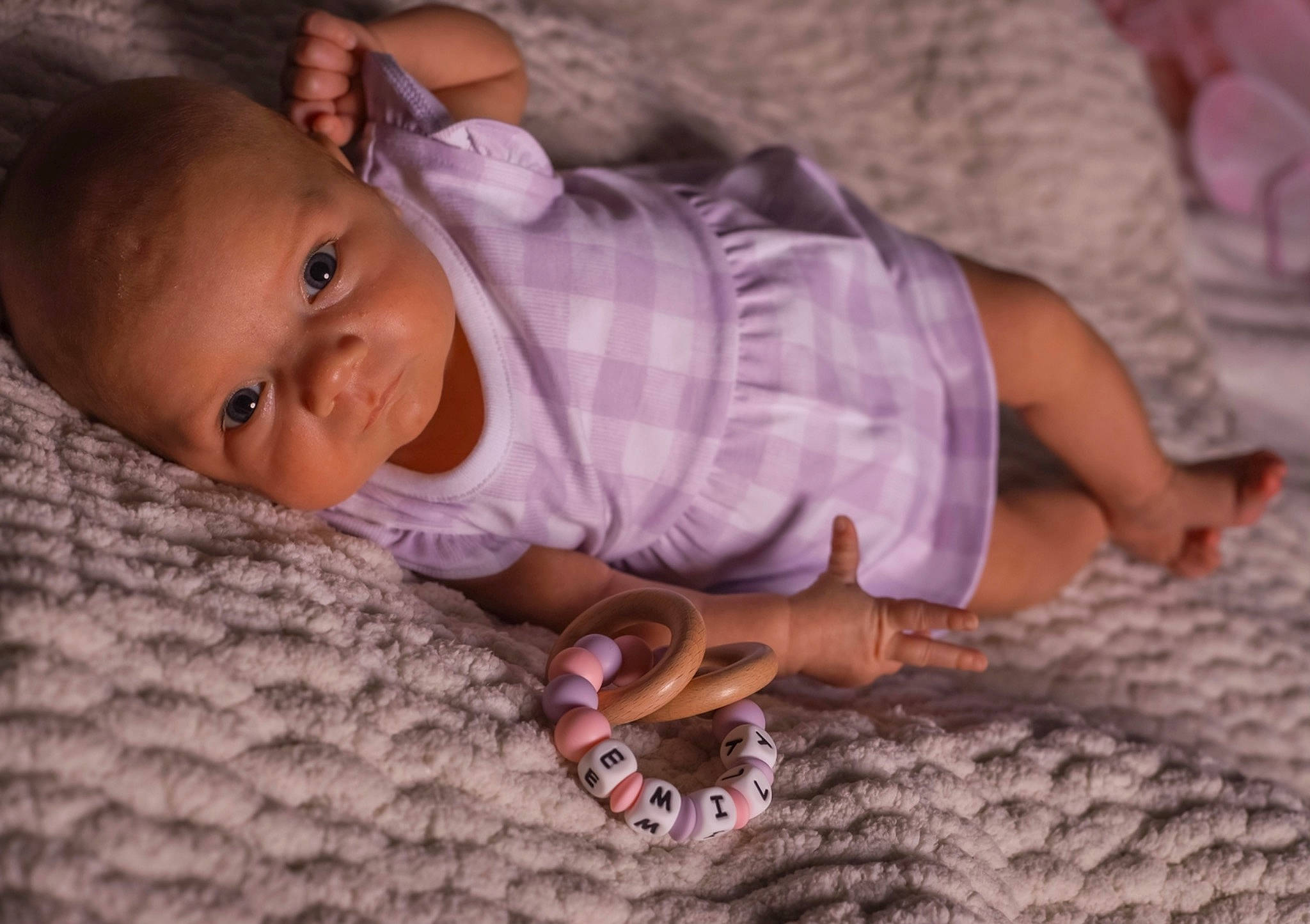 Emily is registered to the contest to win money with this photo: baby, baby_toddler_clothing, cheek, comfort, facial_expression, finger, hand, human_body, iris, leaf, lip, mammal, mouth, nose, person, pink, skin, textile, toddler, vertebrate