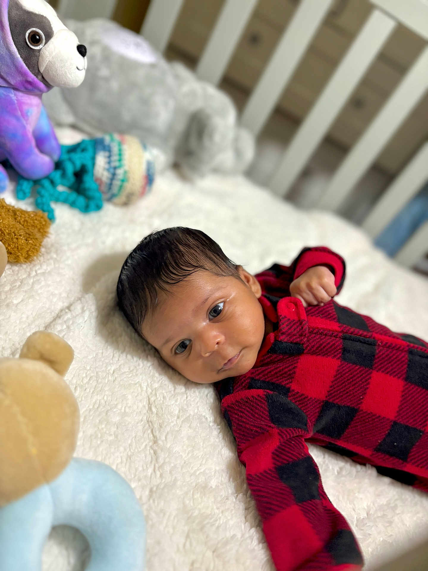 Jheyler joined the competition — help win amazing prizes! baby, infant, plush_toy, stuffed_animal, blanket, crib, red_clothing, black_clothing, checkered_pattern, soft_toys, bedroom, child, cute, lying_down, indoors, cozy, portrait, resting, newborn, face