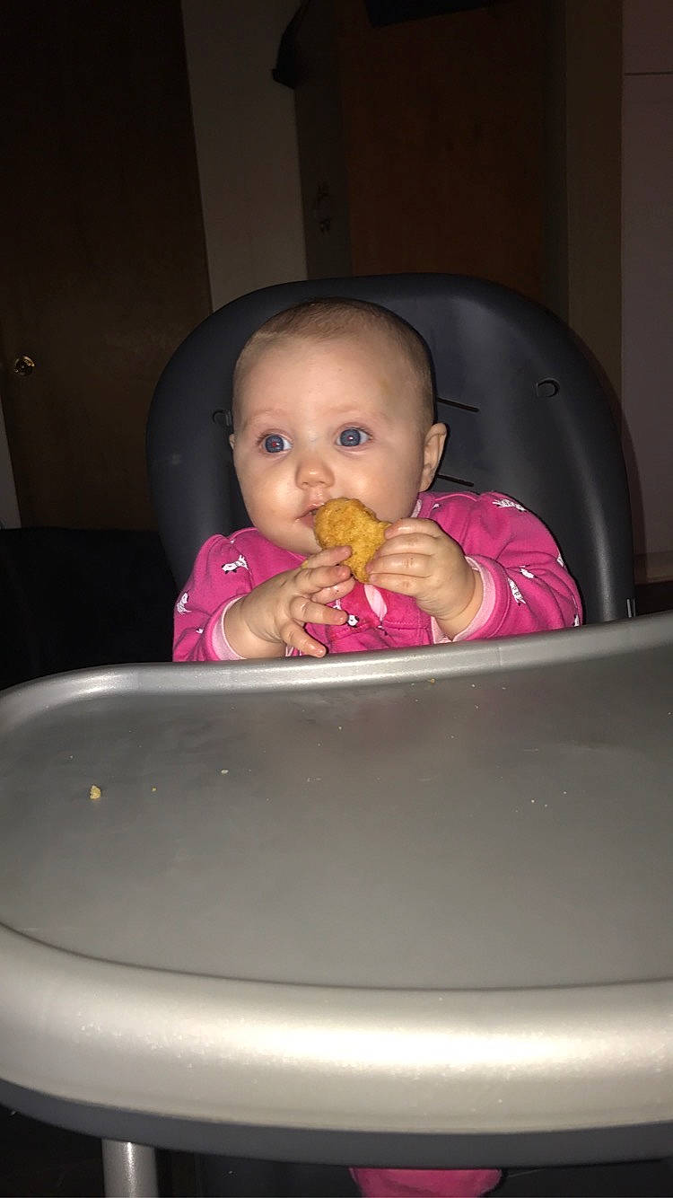 Addilynn is registered to the contest to win money with this photo: baby, baby_products, baby_safety, baby_toddler_clothing, chair, cheek, child, comfort, dishware, eyelash, fun, iris, lip, person, pink, room, sitting, tableware, toddler