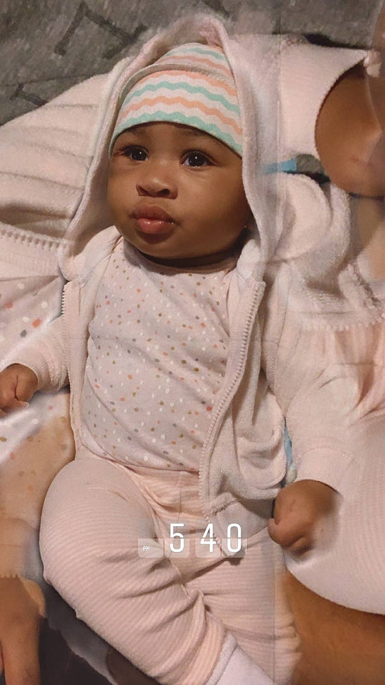 Bailee joined the competition — help win amazing prizes! baby, cap, cheek, child, comfort, eye, face, fashion_design, happy, headgear, headwear, linens, lip, peach, person, pink, sitting, skin, sleeve, thumb